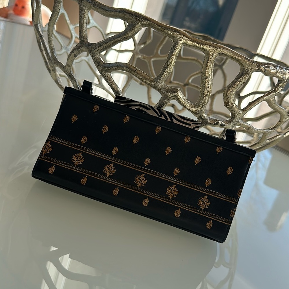 Ladies black and gold clutch